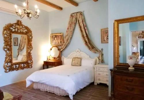 a bedroom with a bed and a dresser, Chateau de France in Yilan