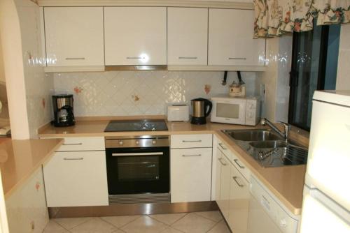Balaia Golf Village apartment 332 by Mickey Pool and snack bar