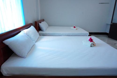 Bed, Cham Island Homestay Lau Thu in Tan Hiep
