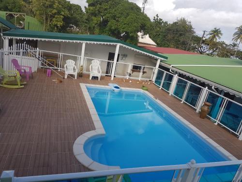 Swimming pool, Domaine fleurs de bananes in Capesterre-Belle-Eau