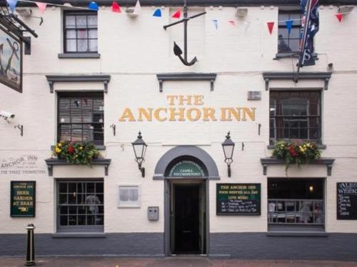 a building with a sign on the front of it, The Anchor Inn in Isle of Wight