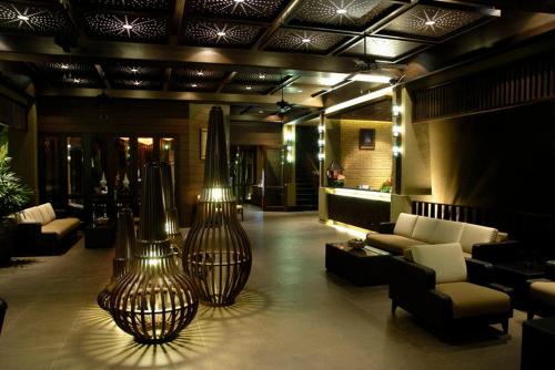 a living room filled with furniture and a large window, Kuiburi Hotel&Resort in Prachuap Khiri Khan