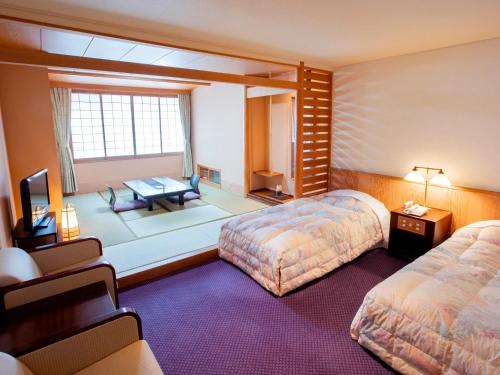 Chambre avec 2 lits, fumeurs acceptés