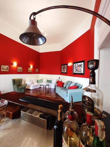 a kitchen with a bar and a wine glass, B&B Palazzo Mirelli in Naples
