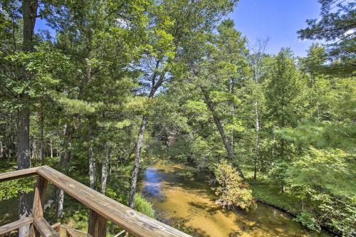 Rustic Riverside Retreat with Wraparound Deck! - image 13