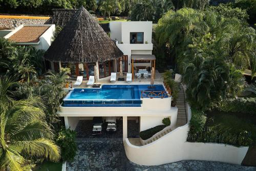 Hear the waves kiss the shoreline! Stunning beach house in five-star beachfront resort