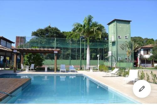 Swimming pool, Caminhe para a Praia de Manguinhos - Casa DECORADA com wi fi, ar e espaco gourmet in Maghuinhos Beach