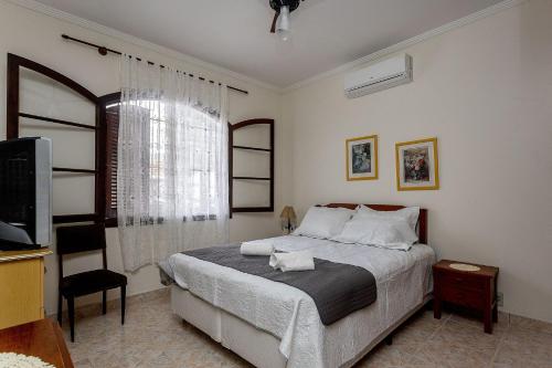 Casa Villagio Santa Monica - Casa com piscina na Praia de Martim de Sa, Caraguatatuba