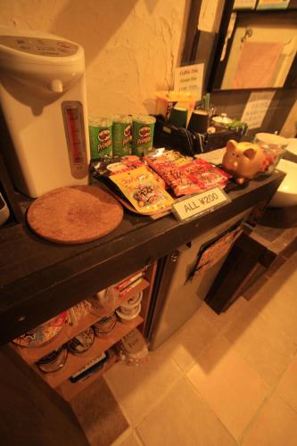 Shared lounge/TV area, Taketomijima Guesthouse and je Taime in Taketomi