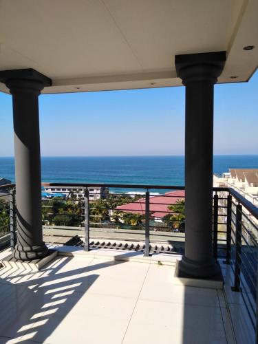 a view from a balcony of a beach with a view of the ocean, Sancta Maria 10 - Ultimate in luxury & majestic sea views includes private entertainment deck - Free in Durban
