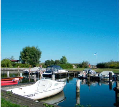 Sonniges Ferienhaus Fischer-Huus vor Usedom & direkt am Haff und Wasserzugang