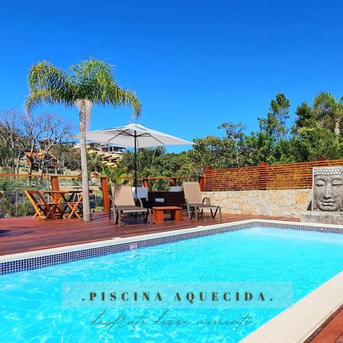 Pousada Paraíso Gaia - Suítes com Banheira e Lareira no centrinho da Praia do Rosa, Piscina Aquecida e Café da Manhã excepcional