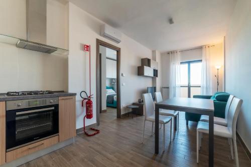 Kitchen, GuestHost - Fonte Laurentina Apartments in Other