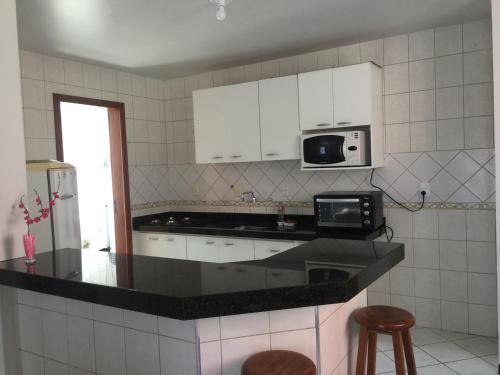 Kitchen, Kasato Maru Residence 100 mts do mar ingleses norte in Ingleses