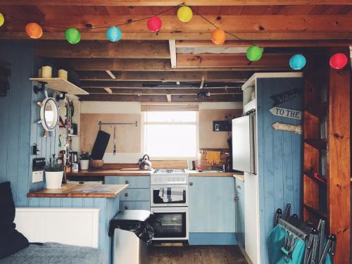 Kitchen, Stargazing Beach Hut on Mudeford Sandbank with wake up sea views in East Southbourne and Tuckton