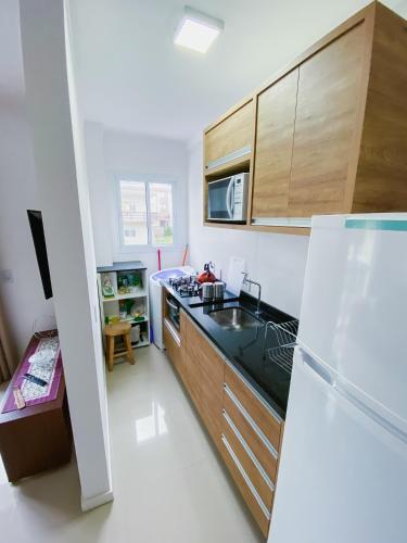 Kitchen, Residencial Santinho Beach in Santinho Beach