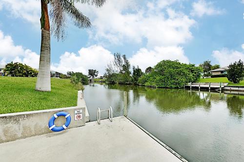 Tropical Retreat with Screened Lanai Saltwater Pool home - main image
