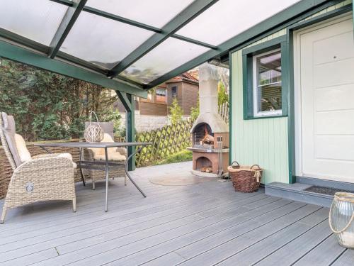 Holiday home with terrace next to the forest