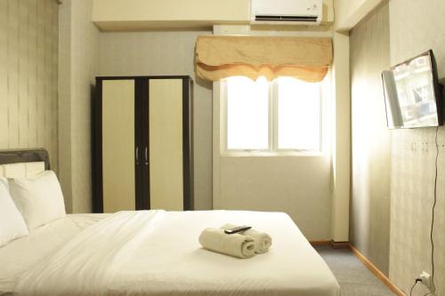 Quiet & Comfy Studio at The Suites @Metro Apartment By Travelio - Tap to explore photos