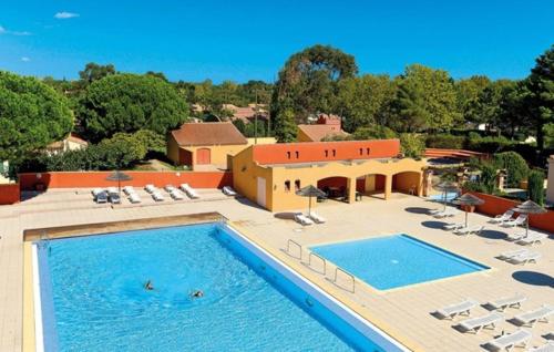 Dans village vacances villa T3 avec piscine, mini golf, tennis - 8OD27 gîte à louer Tatzó d'Avall