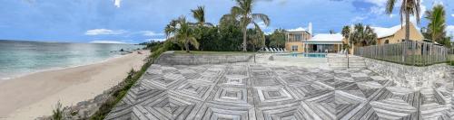 Coral Sea private beachfront panorama with infinity pool