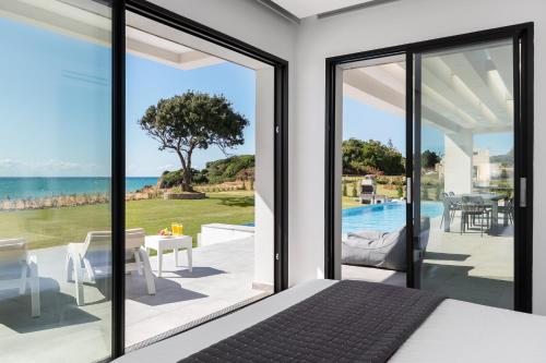 Seafront Villa Nafsika - Private Heated infinity Pool - Direct access to the beach - Play area