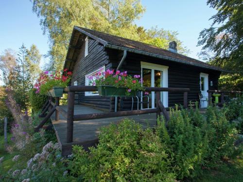 Open wooden chalet built against a hill