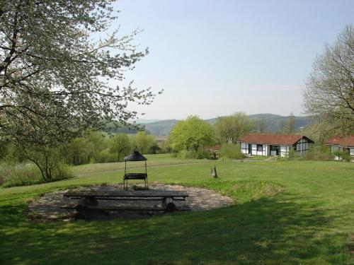 Detached wooden bungalow in a green wooded area - image 9
