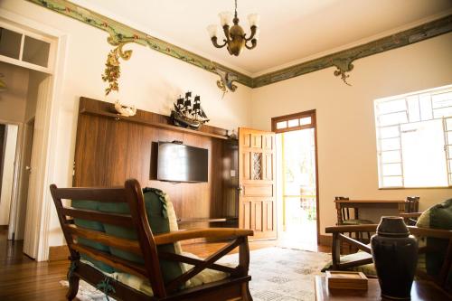 Koplietošanas atpūtas telpa ar TV, Casarao Hostel - Analandia SP in Analandia