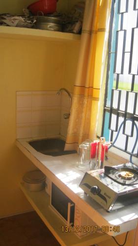 Room in Apartment - Indira Guest House Is In The Heart Of Flic En Flac