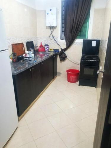 Kitchen, 2 bedrooms appartement with city view enclosed garden and wifi at Sale 3 km away from the beach in Agdal