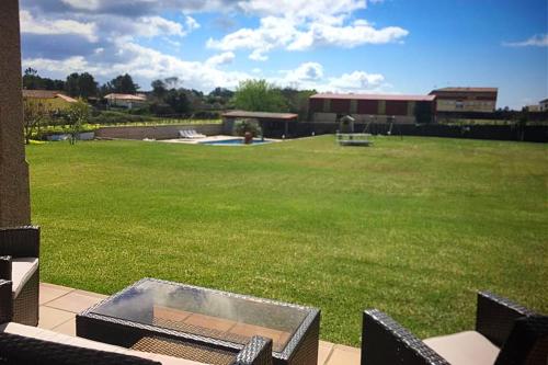 4 bedrooms house with shared pool jacuzzi and enclosed garden at Sanjenjo in Sanxenxo