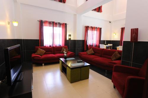 Shared lounge/TV area, Inn Luanda in Luanda
