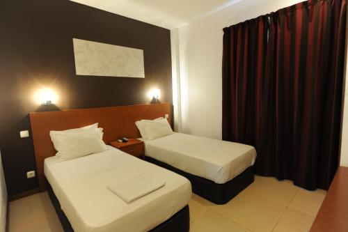 Inn Luanda - Tap to explore photos