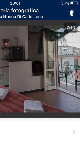 a hotel room with a bed and a window, A Ca Da Nonna Di Callo Luca in Vernazza