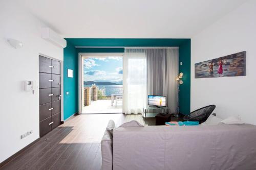 Three-room apartment Chiaretto Rosa - Tourquoise with Large Lake View Terrace gîte à louer Gaino