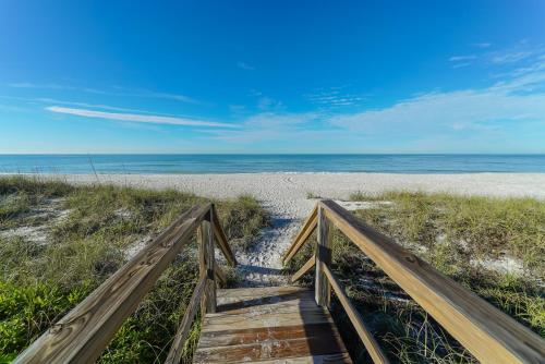 Villa By The Sea is only steps to the white sand, beach gear and 6 bikes for your use