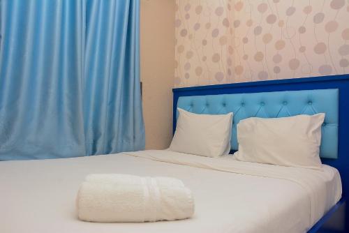 Spacious and Comfy 2BR Bassura City Apartment By Travelio