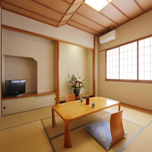 a living room filled with furniture and a window, Hotel Grand Plaza Urashima in Osaki