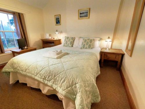 a bedroom with a bed and a window, Strands Hotel/Screes Inn & Micro Brewery in Nether Wasdale