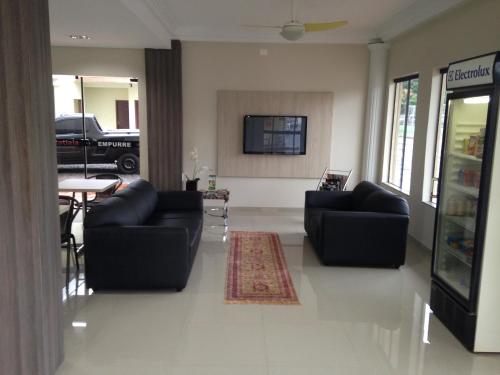 Shared lounge/TV area, Hotel Itatiaia in Tangara Da Serra