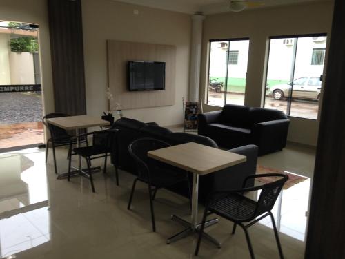 Shared lounge/TV area, Hotel Itatiaia in Tangara Da Serra