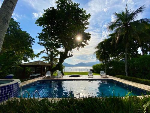 Magnífica casa pé na areia 4 suítes c/ ar e piscina - image 4
