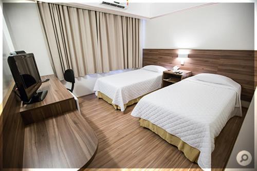 Mogano Business Mogano Business is conveniently located in the popular Chapeco area. Featuring a complete list of amenities, guests will find their stay at the property a comfortable one. Take advantage of the hotel