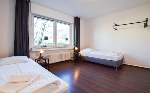 RAJ Living - 1 , 3 and 4 Room Apartments - 20 min Messe DUS & Airport DUS