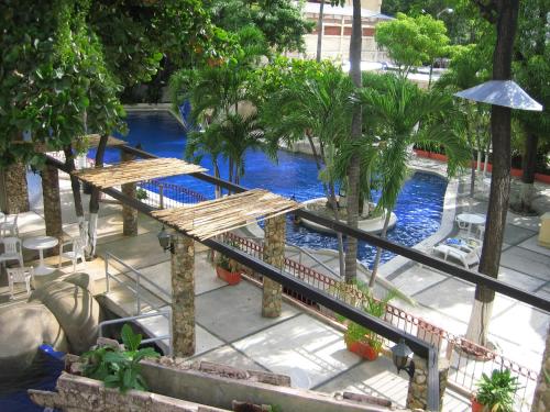 Swimming pool, Hotel Club del Sol Acapulco by NG Hoteles in Acapulco