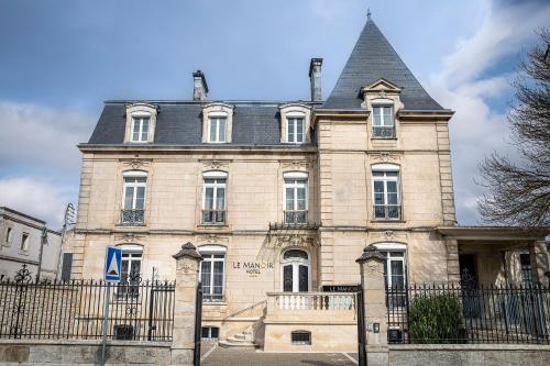 Foto 1: Le Manoir Hôtel