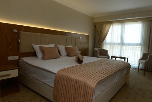 NK Hotel NK Hotel is conveniently located in the popular Kahramanlar area. The hotel offers a wide range of amenities and perks to ensure you have a great time. Facilities like free Wi-Fi in all rooms, 24-hour