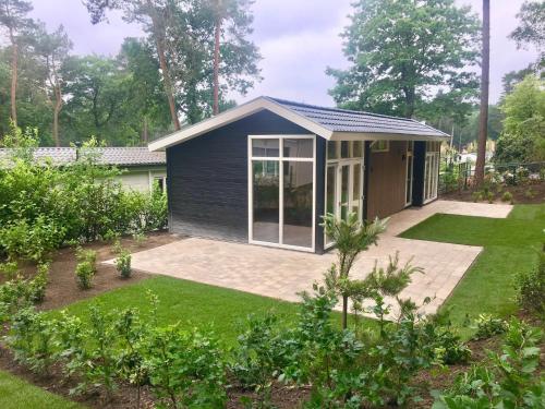 Modern chalet with a dishwasher located in nature - main image