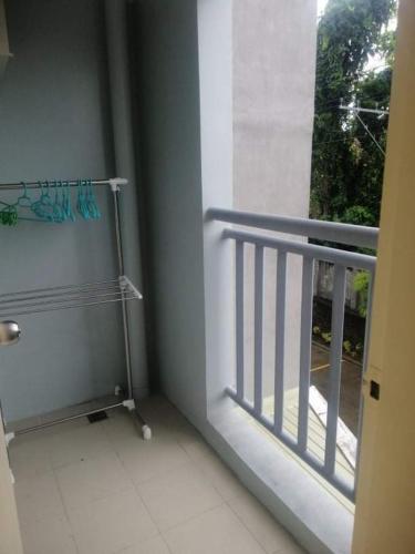 a bathroom with a window and a door, Seawind Condominium, 2 Bedroom, Sasa, Davao City, Philippines in Davao City